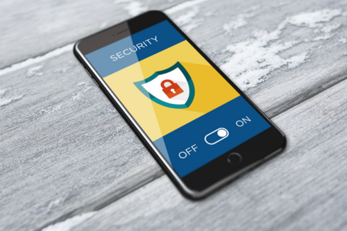 An image of a phone with a cybersecurity lock symbol on the screen.