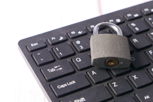Lock sitting on a keyboard.