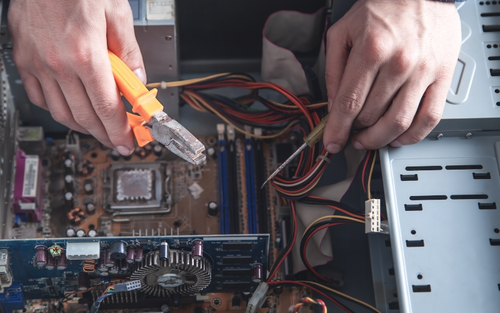 Individual servicing a computer