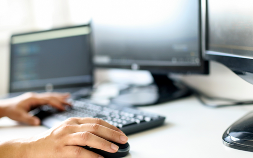 Person on a computer with blurred background 